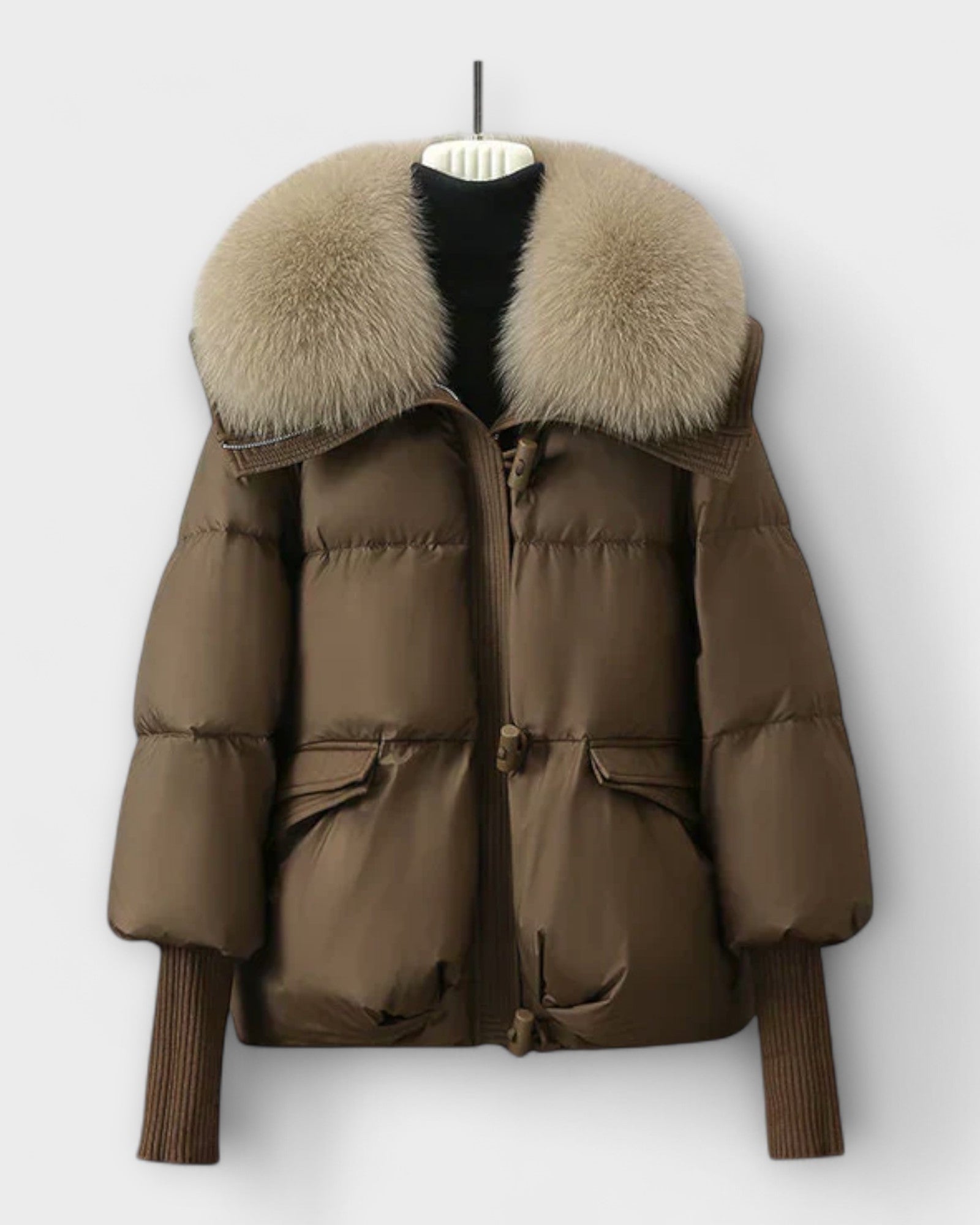 Taupe puffer jacket with faux fur collar, zip front, flap pockets.