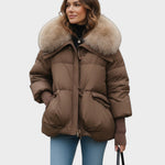 Brown puffer jacket with faux fur collar, zip front, ribbed cuffs.