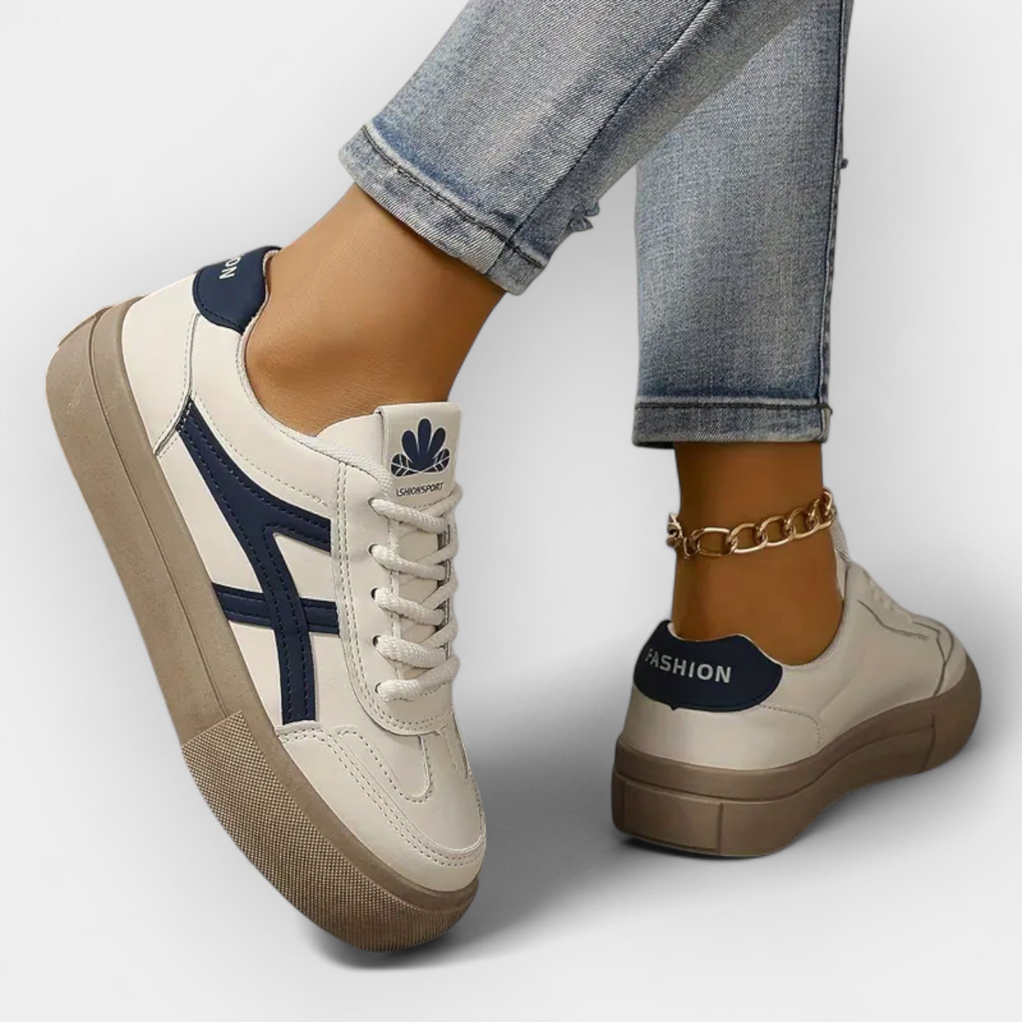Platform retro sneakers, white with navy stripes, tan thick sole and lace-up closure.