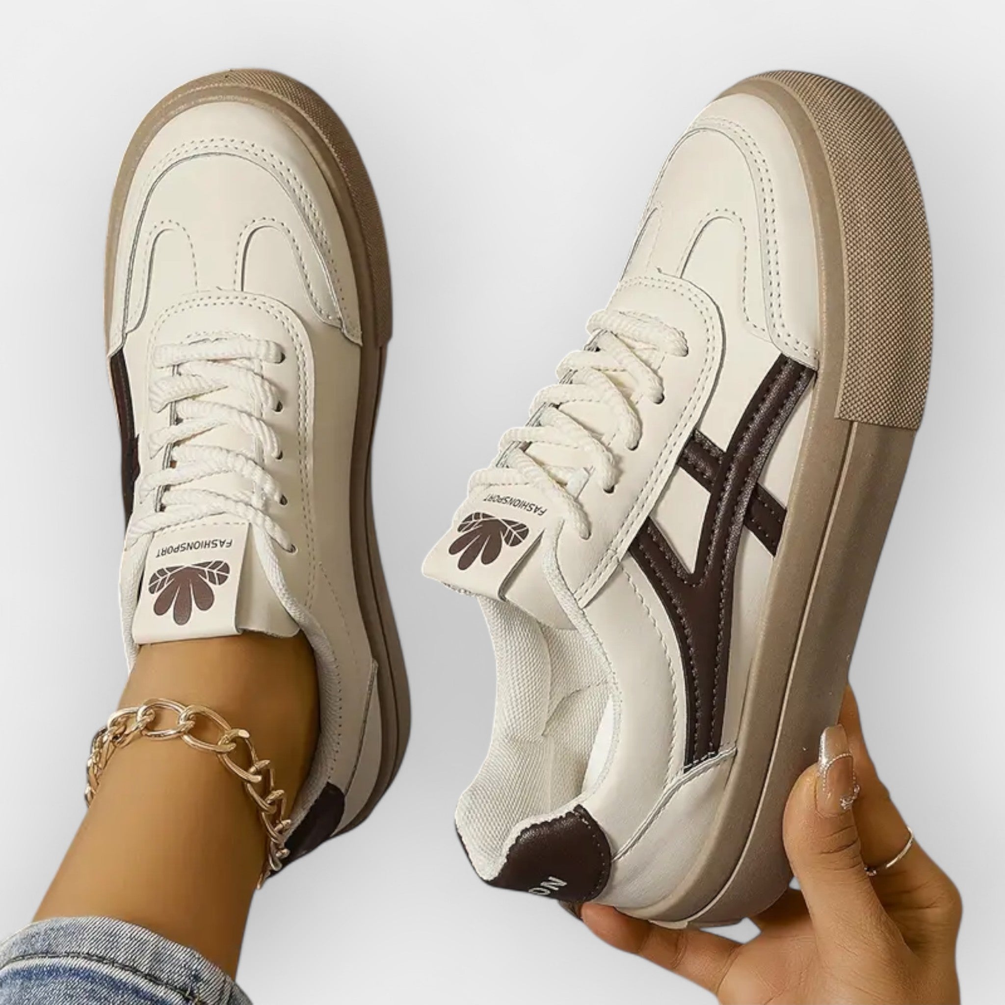 Platform retro sneakers, white upper with navy stripe details and tan platform sole, lace-up.