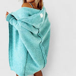 Long teal hooded cardigan with chunky knit, ribbed cuffs and hem, open draped front