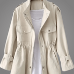 Cream button-front coat with stand collar, chest pockets, and drawstring waist