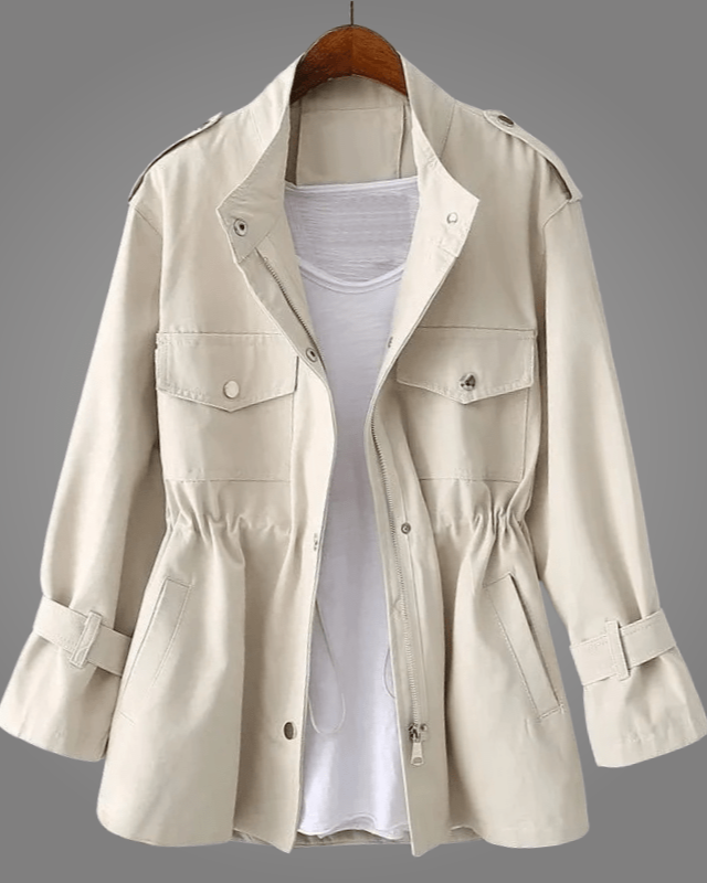 Cream button-front coat with stand collar, chest pockets, and drawstring waist