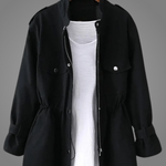 Black button-front coat with stand collar, chest pockets, and drawstring waist