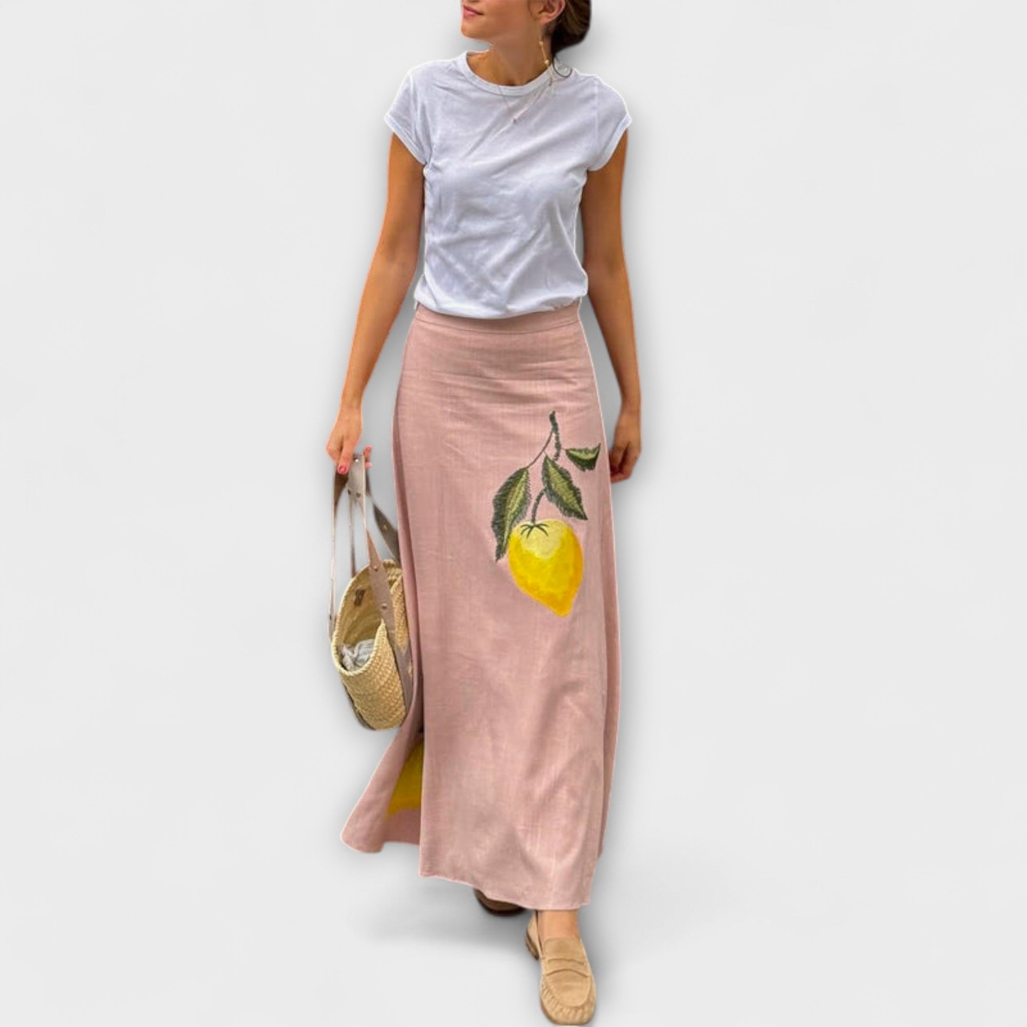 Pink midi skirt with lemon and leaf print, flowy A-line silhouette