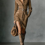 Brown suede midi dress with pointed collar, button front, long sleeves, and belt with buckle