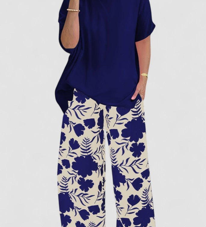 Isolde two-piece set: navy blouse with short sleeves and floral wide-leg pants
