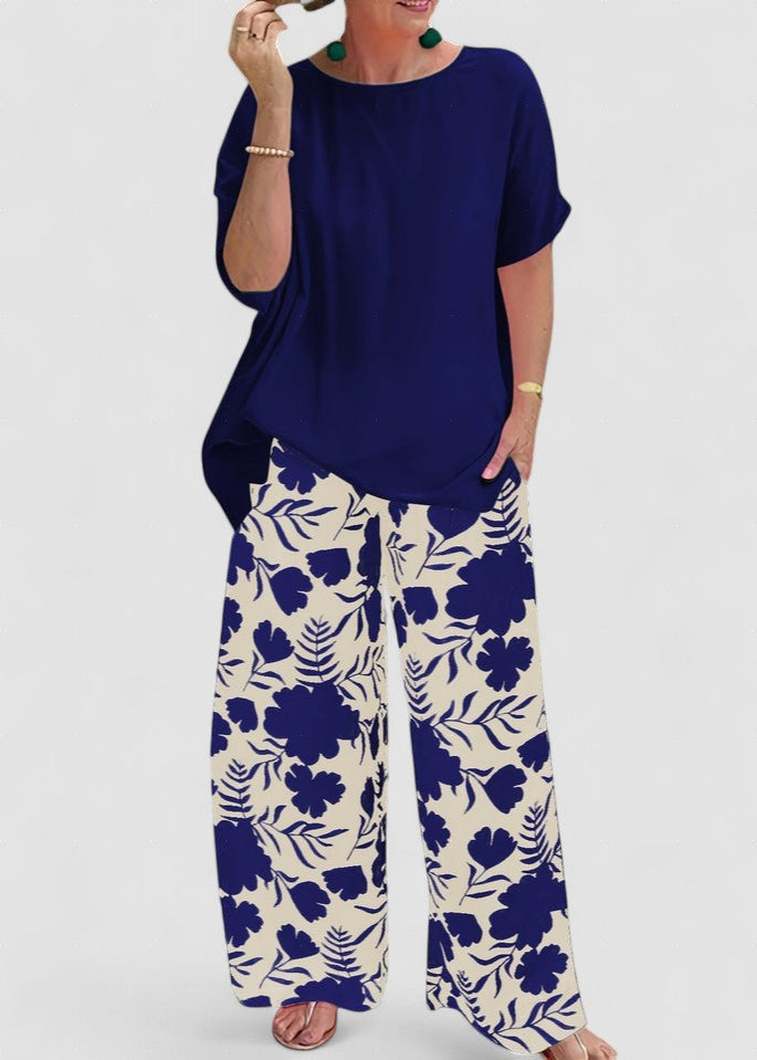 Isolde two-piece set: navy blouse with short sleeves and floral wide-leg pants