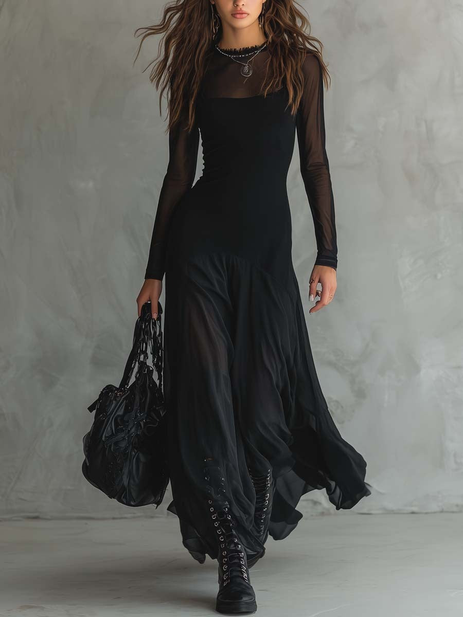 Long black dress with fitted bodice, sheer sleeves, and draped layered hem