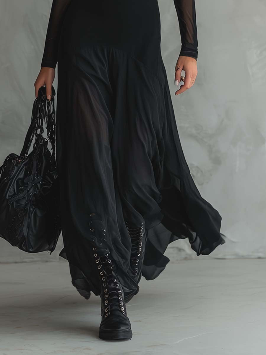 Long black dress with flowing layered skirt and sheer sleeve cuffs