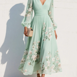 Mint green floral midi dress with V-neck, long sheer sleeves, and flowing skirt