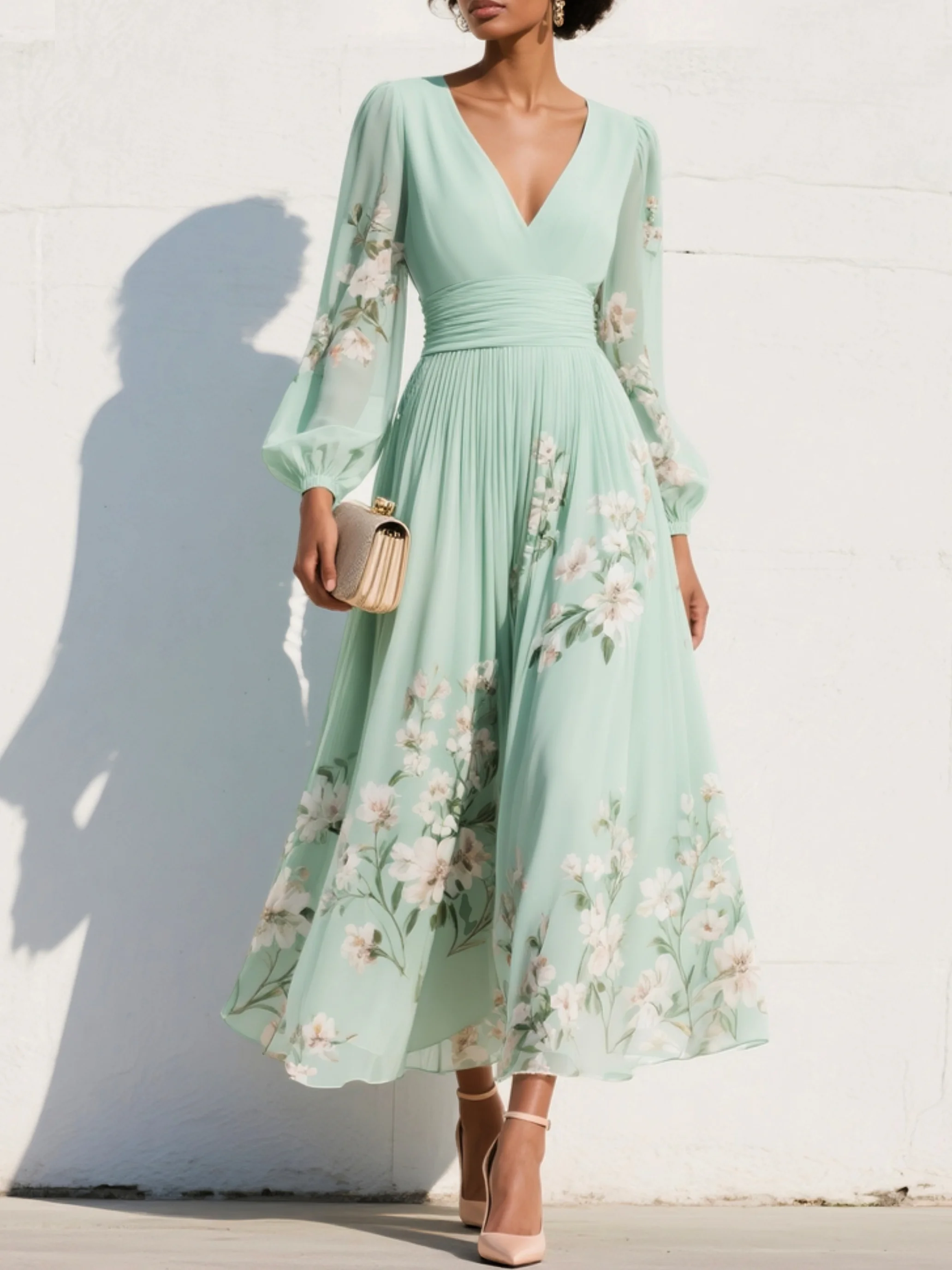 Mint green floral midi dress with V-neck, long sheer sleeves, and flowing skirt