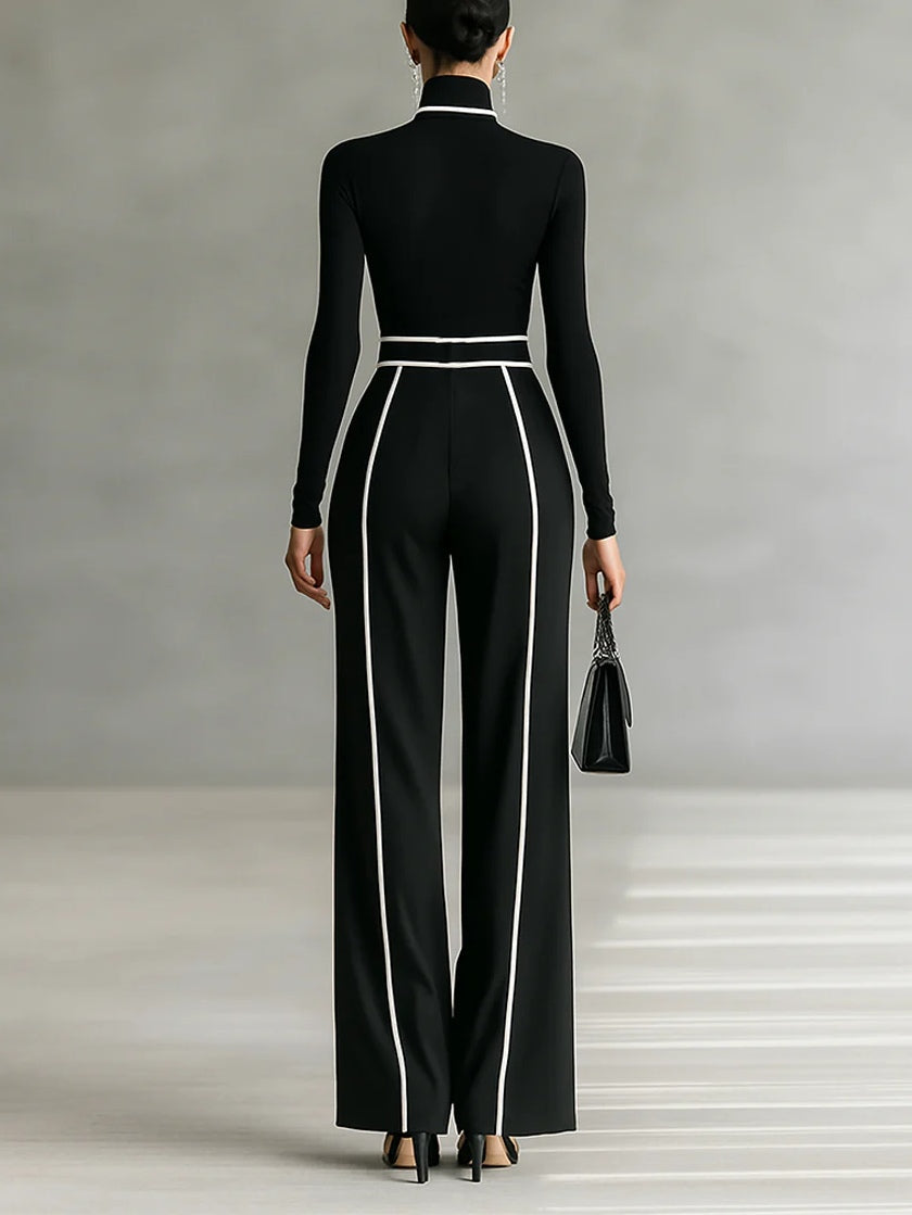 Black high-neck wide-leg jumpsuit, sleeved back view with vertical piping and belt