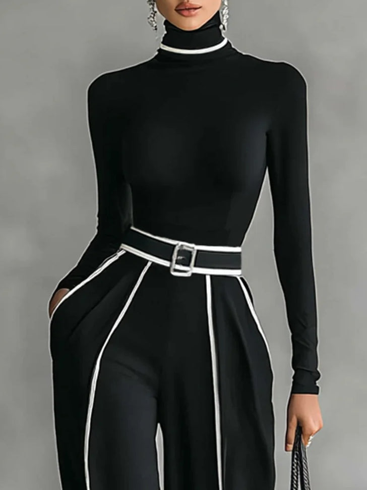 Black mock-neck top with long sleeves and wide-leg pants, white piping belt detail