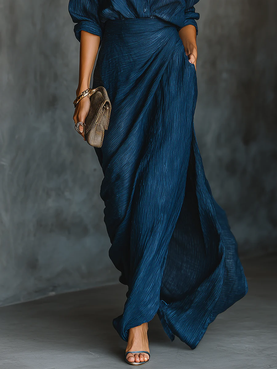 Blue wrap-style wide-leg trousers with textured fabric and ruched high waist