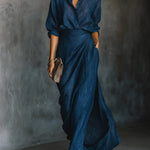 Blue two-piece set with button-front blouse and wrap-style wide-leg trousers
