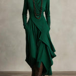 Dark green asymmetrical wrap leggings with layered front drape