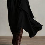 Black asymmetric draped long dress hem detail with layered panels