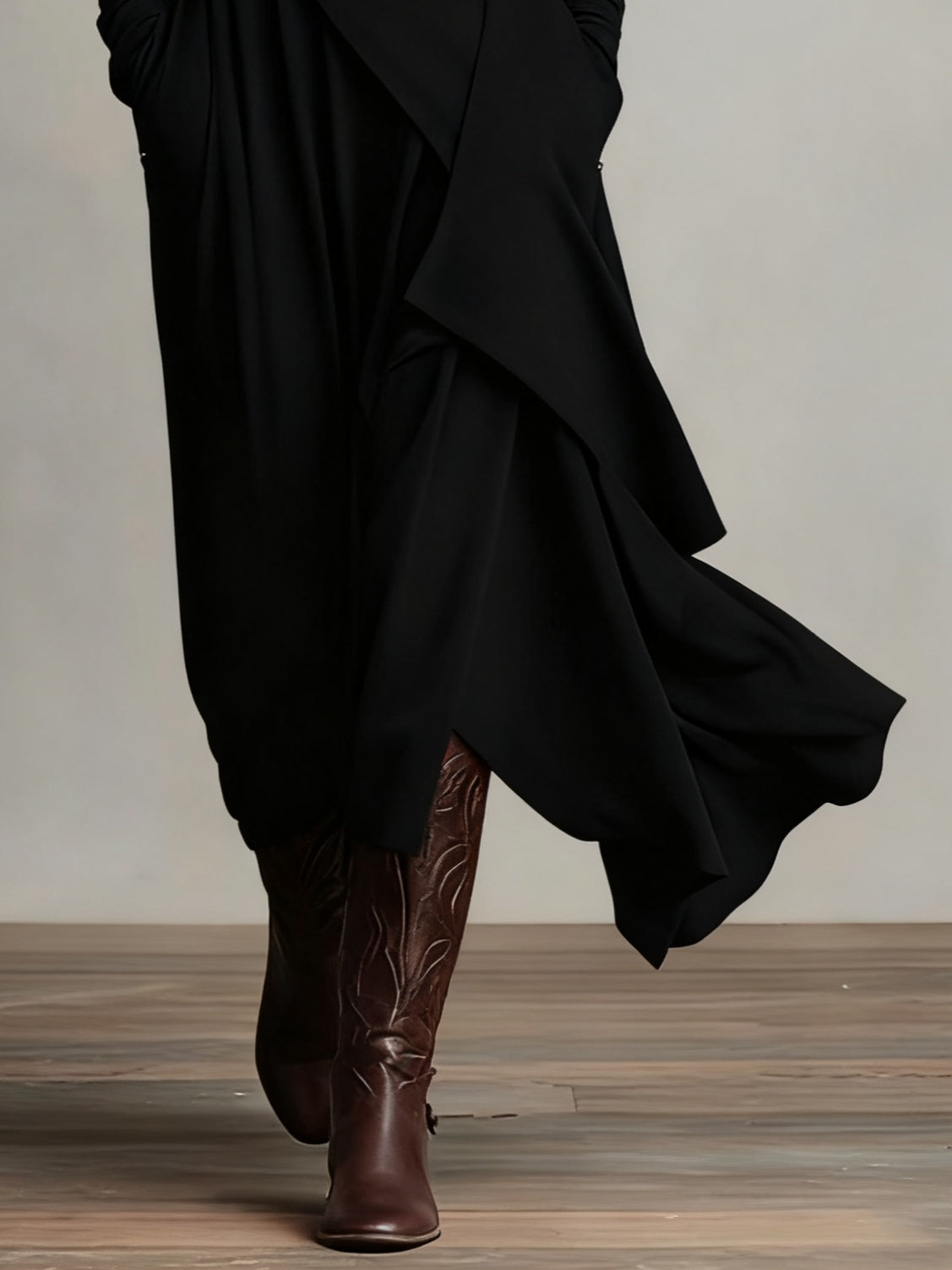 Black asymmetric draped long dress hem detail with layered panels