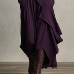 Purple asymmetric draped long dress hem detail with layered panels and long sleeves