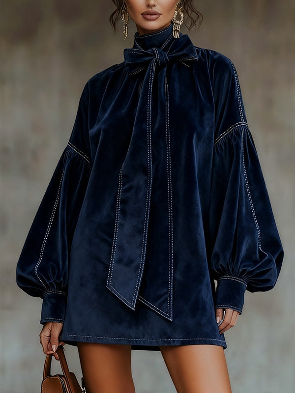 Blue velvet mini dress with bow tie neck, long puff sleeves, stitched detail