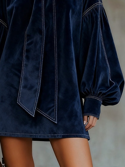 Blue velvet mini dress hem with stitched panel, long cuffed puff sleeves