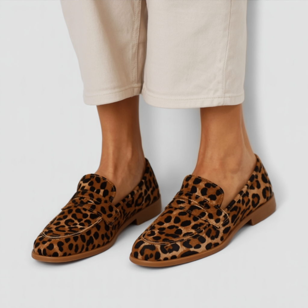 Leopard-print slip-on moccasins with double strap across top and flat sole