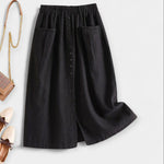 Black midi skirt with elastic waistband, front buttons, and side pockets.
