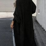 Black long knit cardigan, back view, relaxed fit with textured fabric