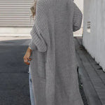 Light gray long knit cardigan, back view, loose fit with ribbed cuffs and side pockets