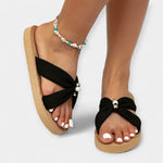 Women's wide bow sandals in black, braided platform sole with wide toe-bow strap