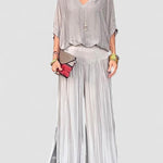 Two-piece chiffon set with draped blouse and wide-leg pants, light gray-silver.