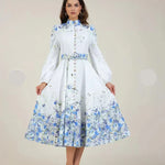 White-blue floral midi dress with high neck, tie waist and long sleeves with full skirt