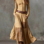 Beige suede-look maxi dress with front buttons, wide leather belt, and plaid patchwork panels