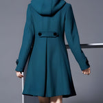 Women’s teal hooded coat, back view with center yoke and belt-like waist tab
