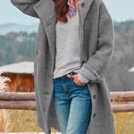 Long gray hooded coat with button front and side pockets