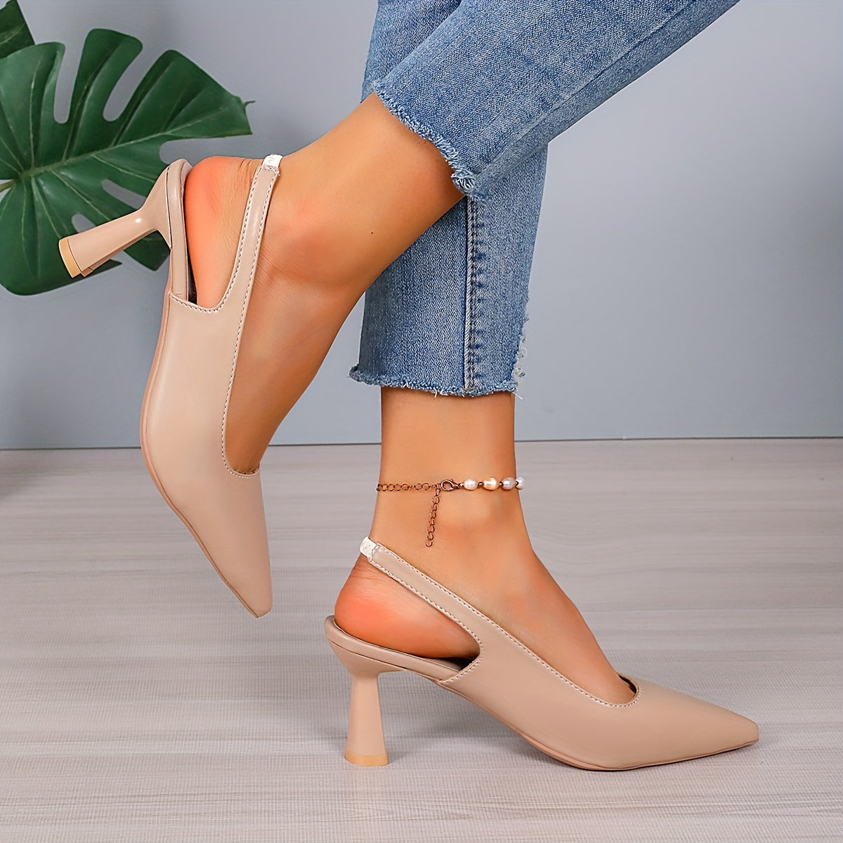 Beige orthopedic pointed-toe heels with slingback strap and mid block heel