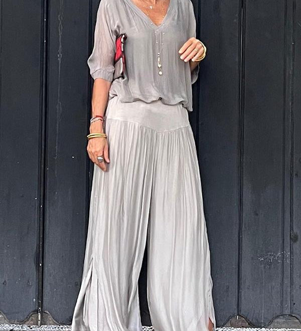 Two-piece chiffon set with V-neck blouse and flowy wide-leg pants, light gray.