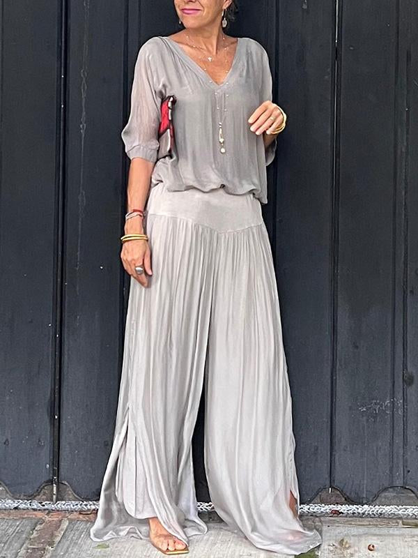 Two-piece chiffon set with V-neck blouse and flowy wide-leg pants, light gray.