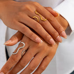 Gold- and silver-tone asymmetric wave rings with curled open-loop profiles