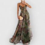 Green maxi dress with spaghetti straps, V-neck and multicolor floral print skirt