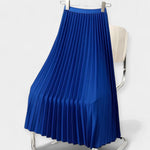 Long pleated satin skirt, royal blue with elastic waistband and airy A-line fall.