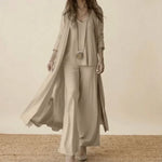 Light beige 3-piece set with long duster, tunic top, and wide-leg trousers.