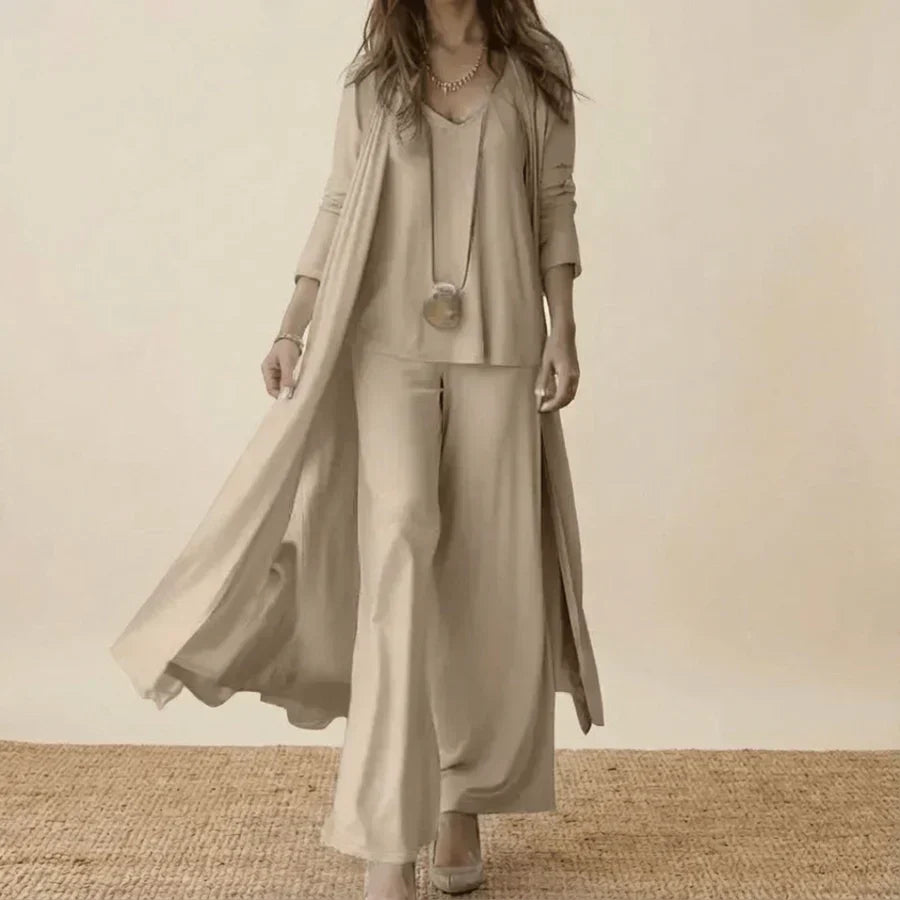 Light beige 3-piece set with long duster, tunic top, and wide-leg trousers.