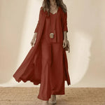 Rust red 3-piece set with long duster, layered tunic, and wide-leg trousers.