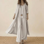 White 3-piece set with long duster, tunic top, and wide-leg trousers.