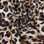 Leopard-print jacket fabric close-up with ruched tie-knot detail