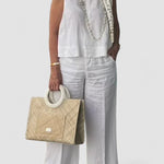 White sleeveless cotton-linen top with wide-leg pants