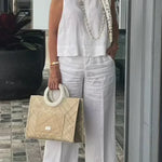White sleeveless cotton-linen top with wide-leg pants