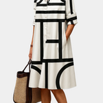 Summer dress with black-and-white geometric blocks, collared button-front, 3/4 sleeves